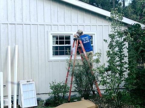 Worker installs a window